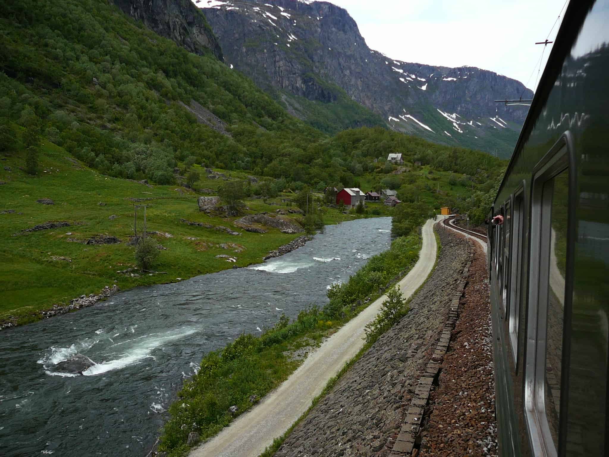 The Flamsbana runs from Myrdal to Flåm, a town in the valley of the UNESCO fjords. It is a train ride through the mighty fjord landscape.